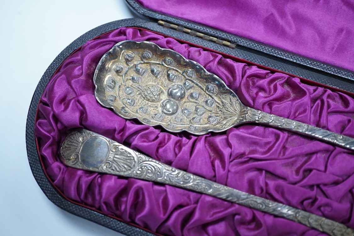 A cased pair of George III engraved silver Old English pattern berry spoons, by Smith & Fearn, London, 1794/5, 22.6cm, together with a cased Edwardian silver christening trio, an 800 standard mustard pot with white metal
